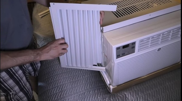 Attach the side panels in the Small window air conditioner